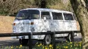 Left side view of a white classic VW Campervan