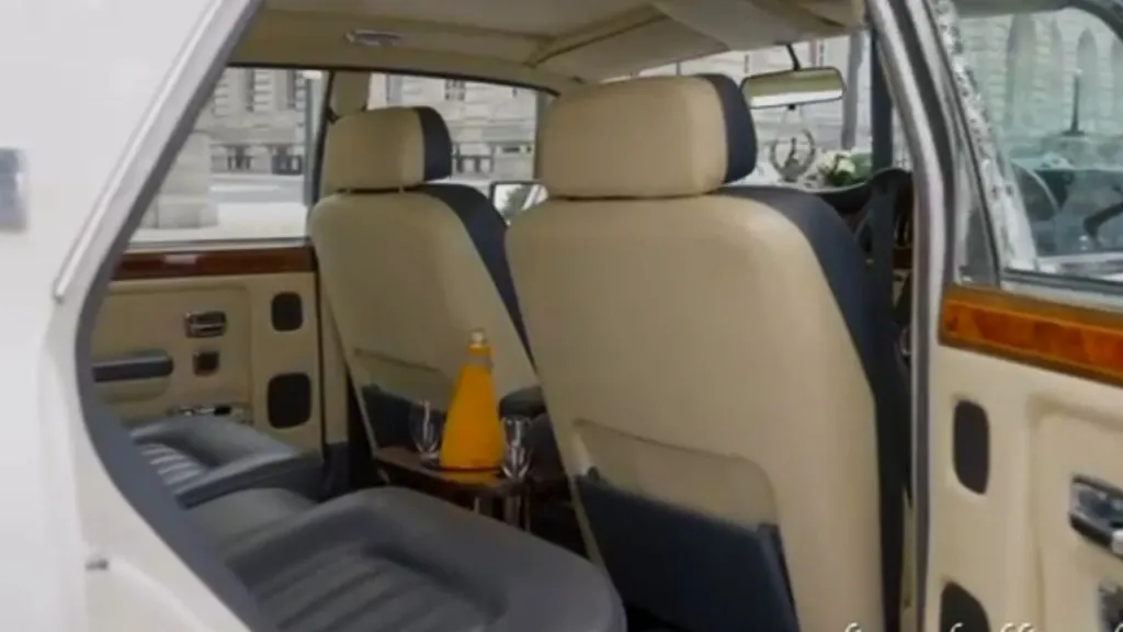 Rear interior leather seats inside a classic Rolls-Royce in White