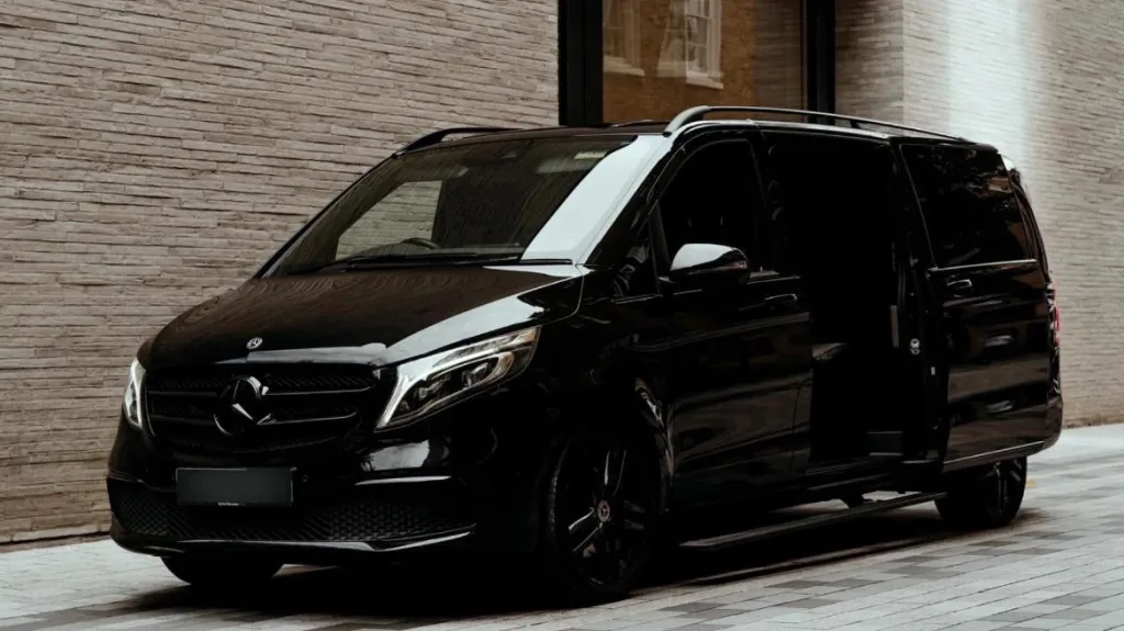 Front left view of a Black Mercedes V-class Multi seater with privicy windows