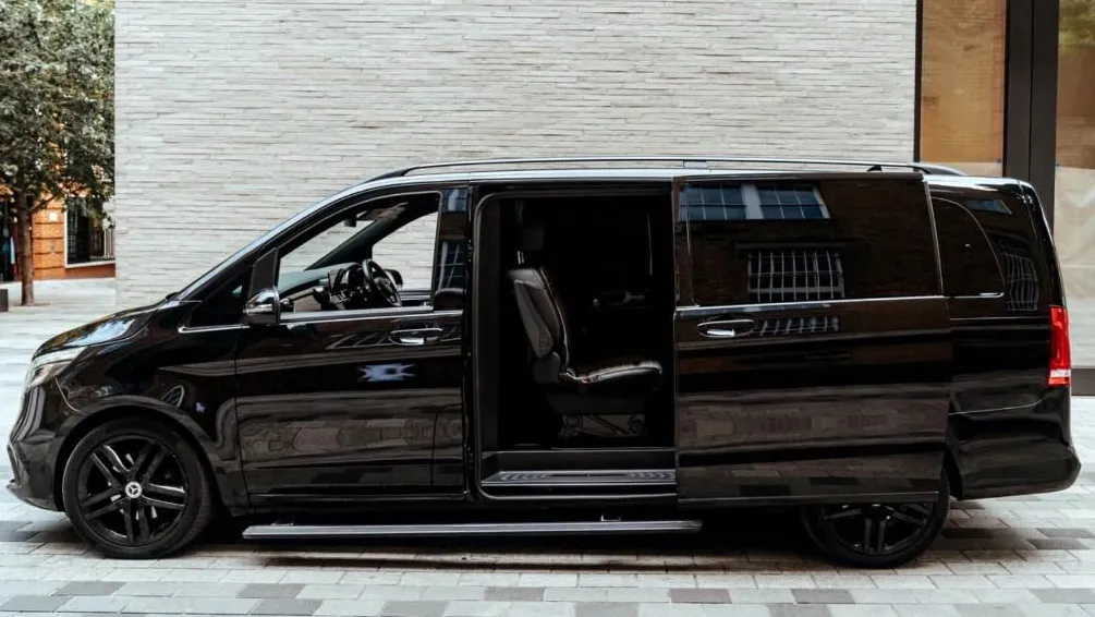 Left side view of Black Mercedes V-Class with rear passenger sliding door open