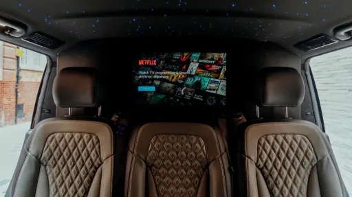 Rear facing black and grey leather seats inside Mercedes V-class