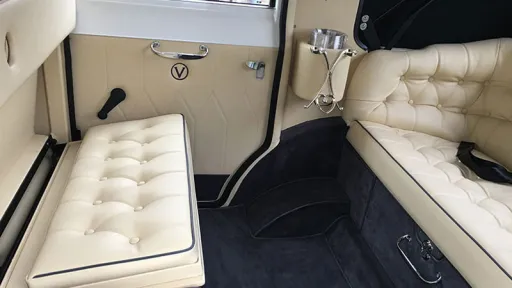 rear seating compartment with casual seats lowered and facing the rear bench seat.