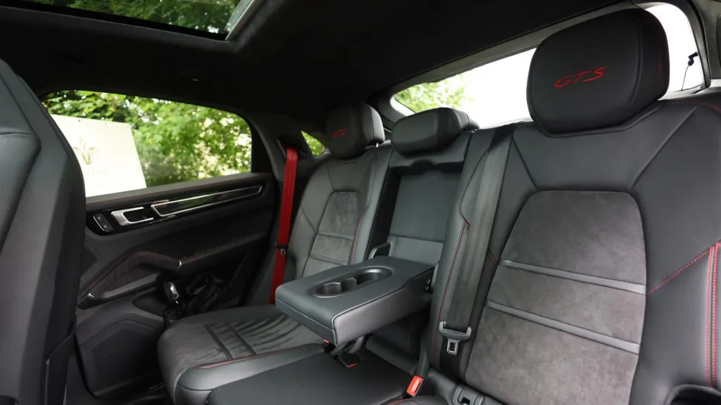 Black Porsche Cayenne GTS rear interior seating with central rear armrest down