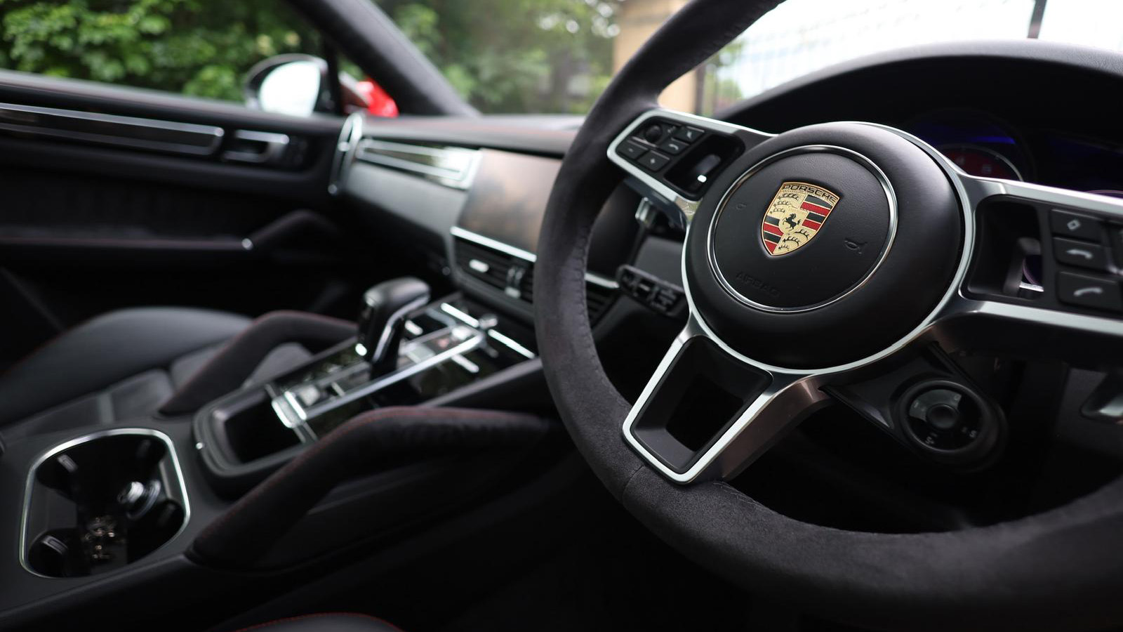 Black Porsche Cayenne GTS close-up view to front driver dashboard