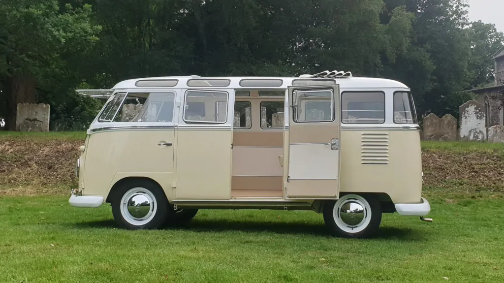Left side view of Classic Volkswagen Campervan in White & Cream with rear passenger door open