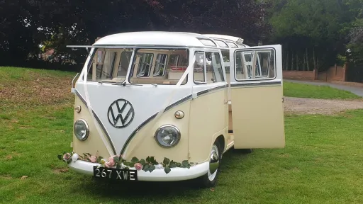 Front view of Classic Volkswagen Campervan in White & Cream with passenger rear door open