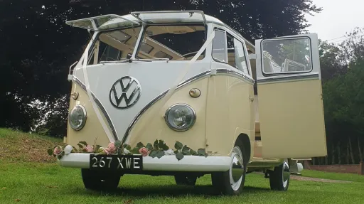Classic Volkswagen Campervan in White & Cream with front splitscreen windows open