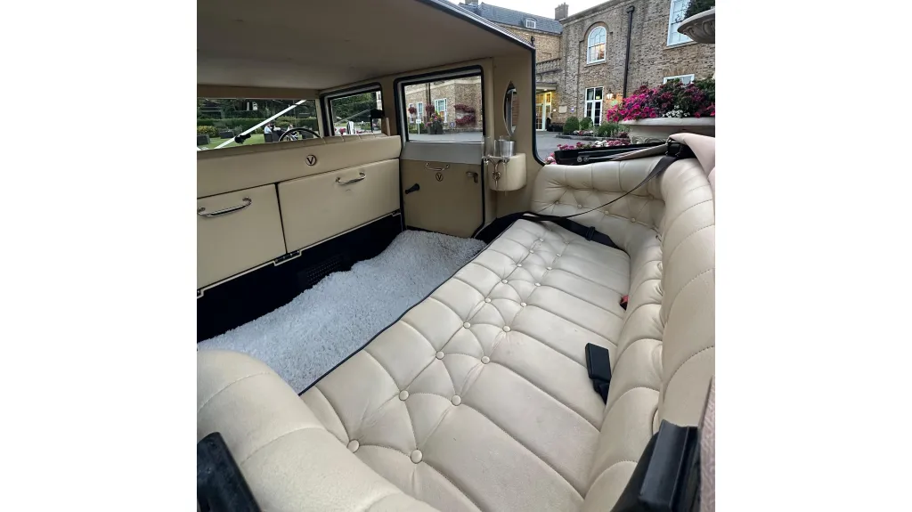 Cream leather rear bench seat inside imperial wedding car