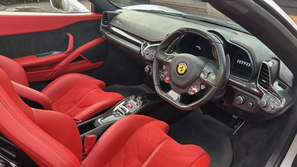 Red leather interior seats from the driver's side