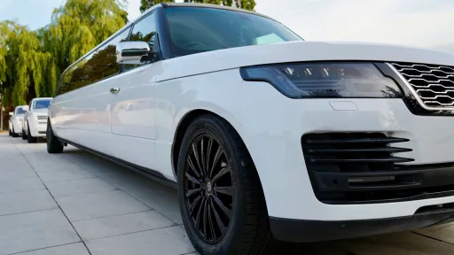cl;ose up view of white Range Rover Stretched Limousine with black alloy wheels