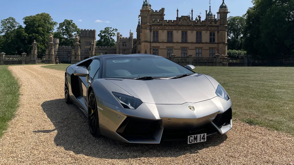 Lamborghini Aventador wedding car outside a grand stately home