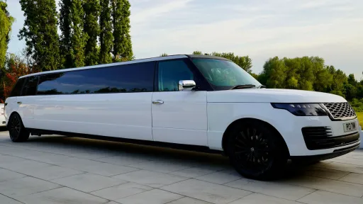 White Range Rover Stretched Limousine with black wheels and tinted windows