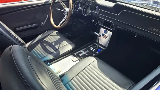 front passenger seat of black leather inside Ford Mustang