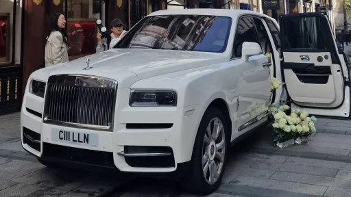 Fromt Side view of Rolls-Royce Cullinan in the garden of a popular wedding venue in Essex