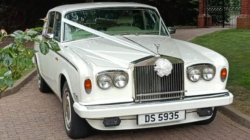 Rolls-Royce Silver Shadow mk 2 dressed with white ribbons and a large bow