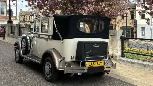 Rear view Imperial Viscount Landaulette with black soft top roof closed
