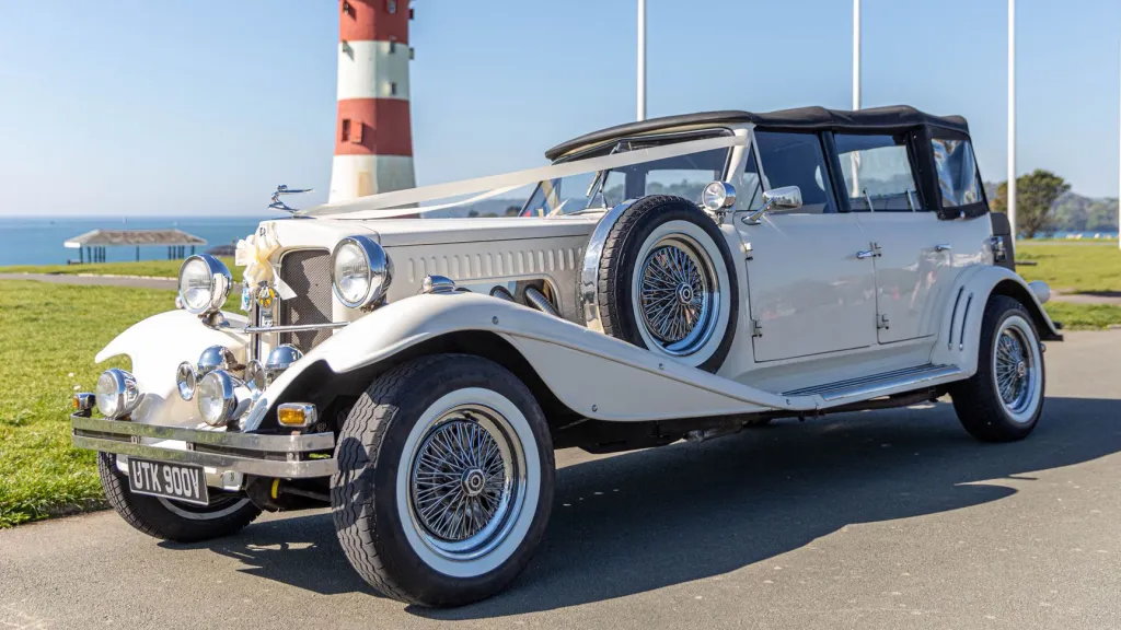 vintage Beauford with black soft top closed