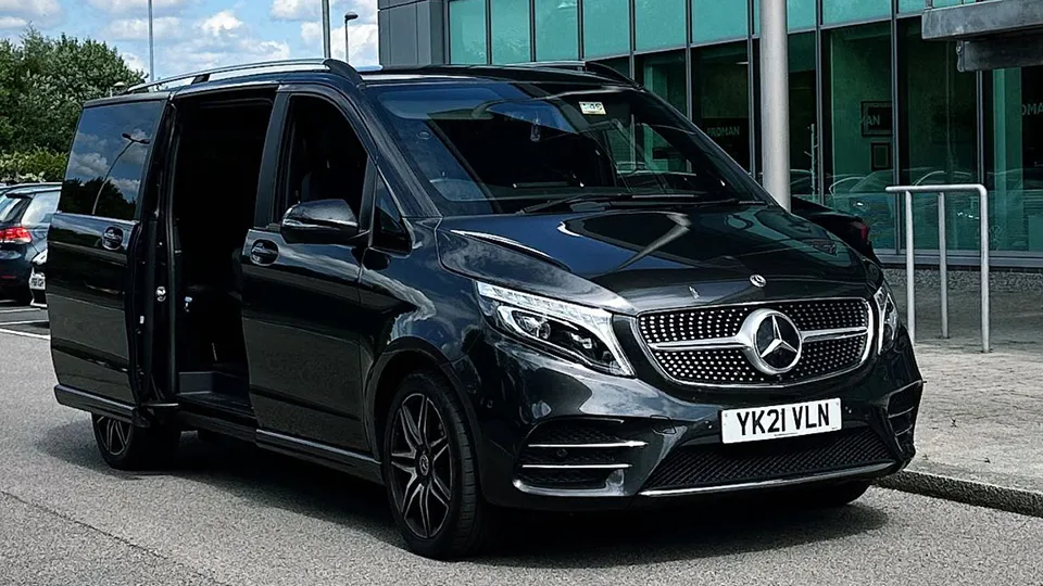 Black Mercedes V-class parked in front of wedding venue in Manchester