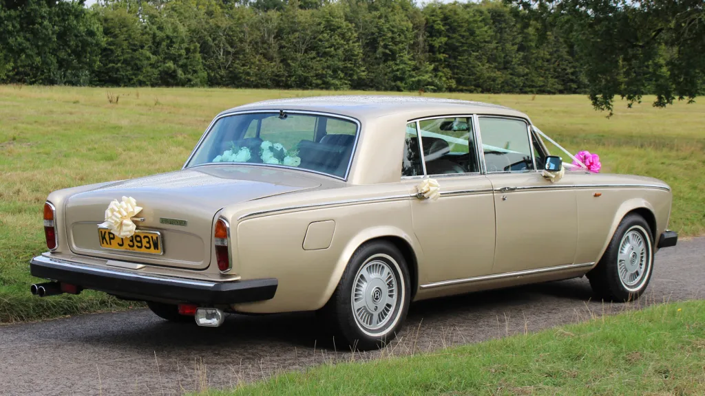 right side rear view of classic Rolls-Royce Silver Shadow with ribbons