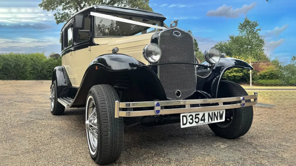Front view of Black and ivory Badsworth dressed with white ribbons across front bonnet
