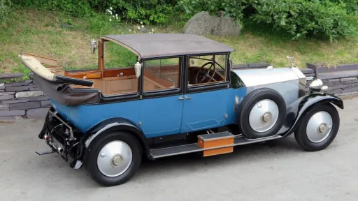 Aerial view of blue vintage Rolls-Royce Phantom 1 with landaulette convertible roof open