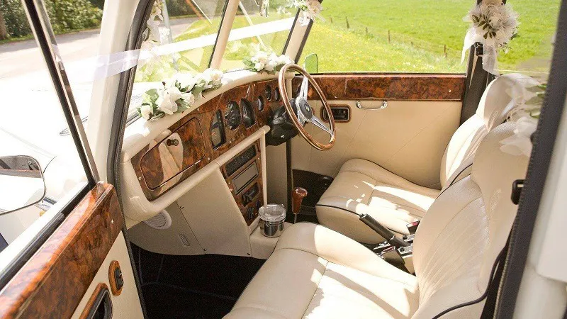 Front interior os cream leather wooden dashboard and doorcards tops