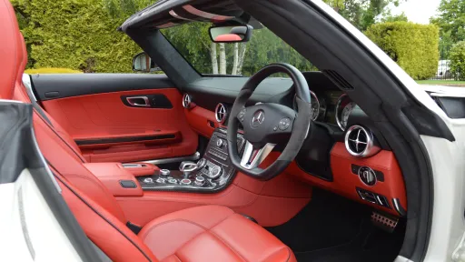 White Mercedes SLS AMG interior seats with dashboard