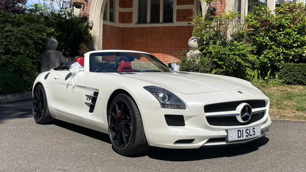 White Mercedes SLS AMG wedding car in front of a wedding venue in Hertford