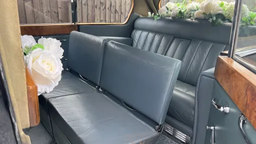 Austin Princess Limousine interior with both casual seats open showing additional two seats inside the rear compartment