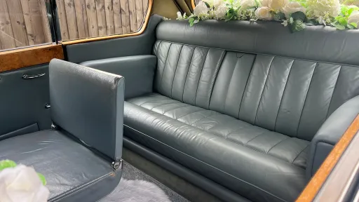 Austin Princess Limousine rear cabin interior with one of the additional casual seat up showing an additional seat