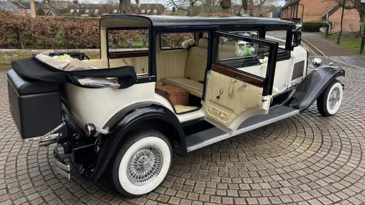 Right side view Bramwith with convertible roof open and rear passenger door open showing large entrance and a cream leather interior