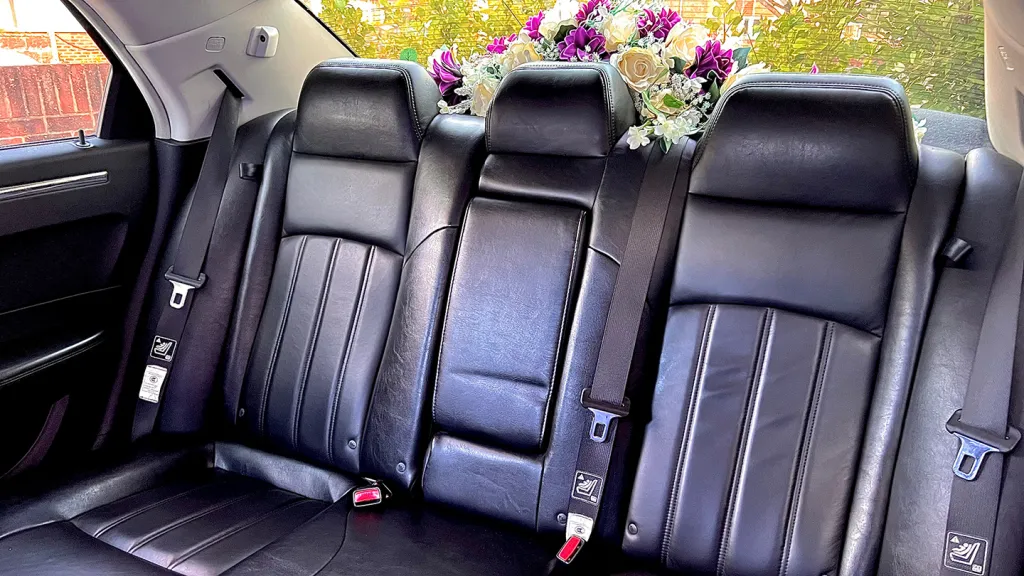 rear interior black leather interior with flower decoration on the rear parcel shelf