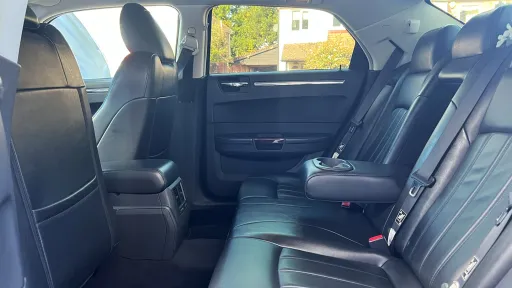 black leather interior inside chrysler 300c saloon with large legroom