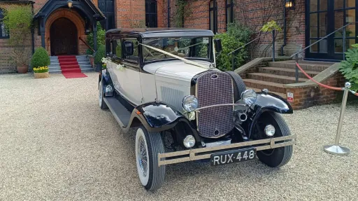 Full front view of vintage-style Bramwith parked at a wedding venue
