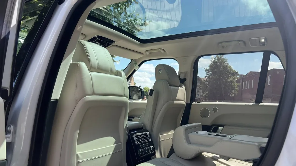 Cream leather interior inside Range Rover with panoramic sunroof