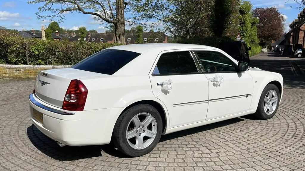 Rear right view of white chrysler 300c saloon