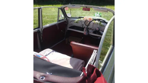 Classic Morris Minor Convertible aerial photo of the interior with roof open showing a Marron leather interior with one seat at front and two seats at the rear