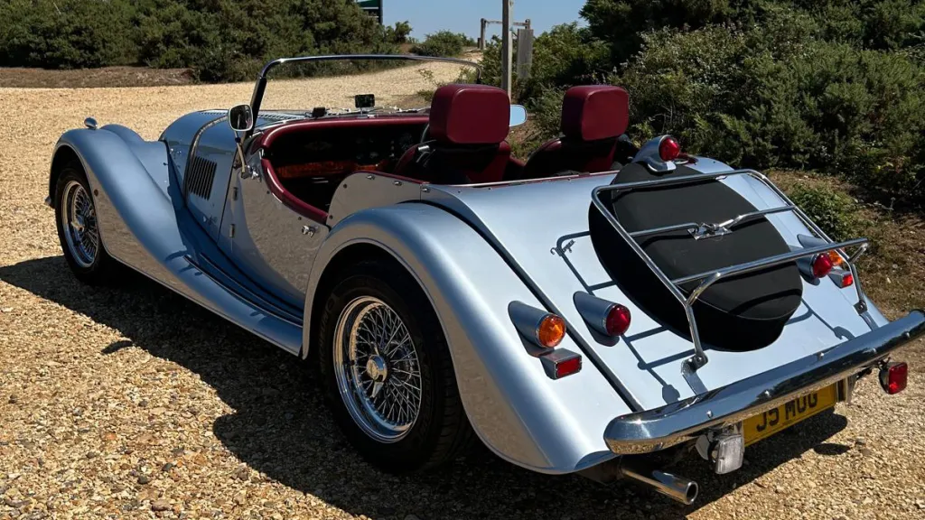 Morgan 4-wheeler left rear view with spare wheel mounted at the rear under a black cover