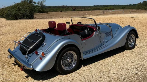 Rear right side view of a convertible Morgan 4-wheeler