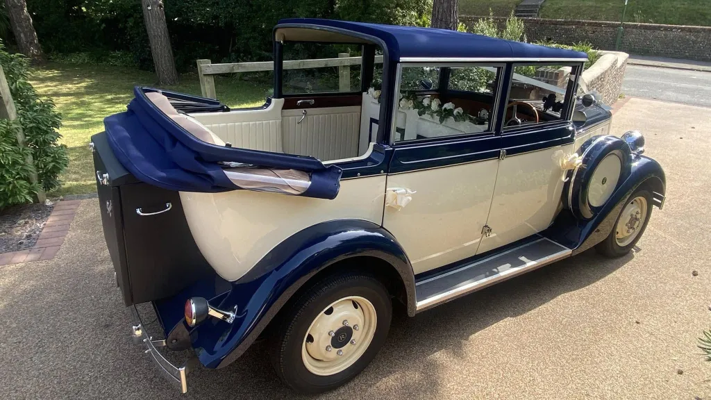 convertible roof open on a vintage style regent showing a cream leather interior