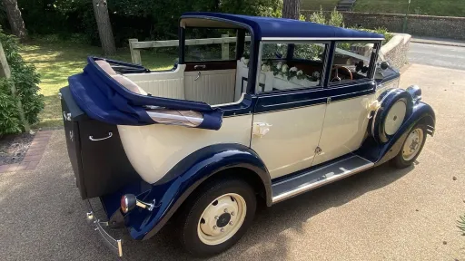 convertible roof open on a vintage style regent showing a cream leather interior