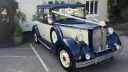 30s style vintage Regent in Blue and Cream with large ivory ribbon and bow decorating the car