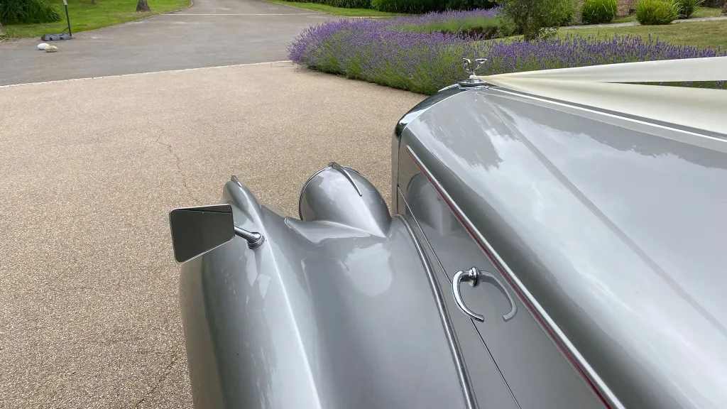 Close-up of the silver Bentley R-Type bonnet with classic winged mascot