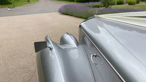 Close-up of the silver Bentley R-Type bonnet with classic winged mascot