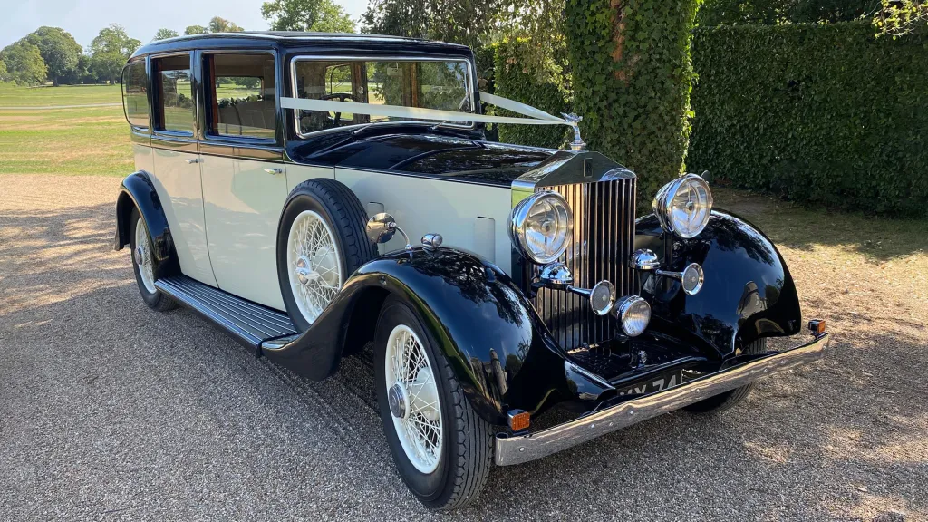 Vintage Rolls-Royce 20/25 wedding car parked on gravel