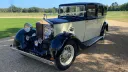Vintage Rolls-Royce 20/25 driving along a country road