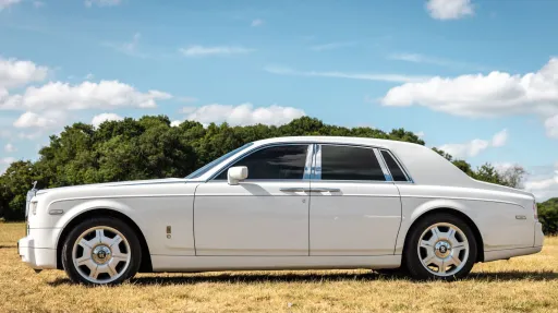 Left side view of White rolls-Royce Phantom