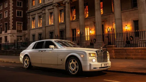 White side view of Rolls-Royce Phantom at dusk in London street