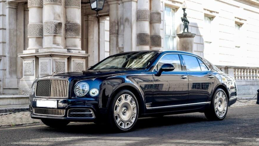 Blue Bentley Mulsanne with large alloy wheels finished in chrome