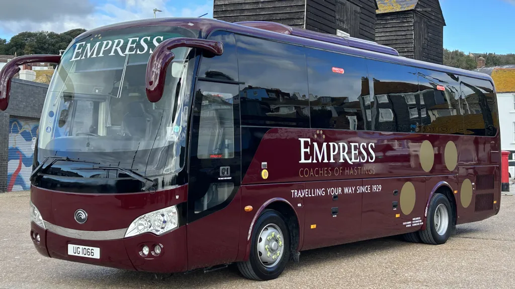 Mercedes 35 Seater Bus in Burgundy parked in Sussex